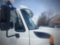 A 2016 International WorkStar 7500 truck featuring a white exterior and distinctive design elements like a prominent hood and side mirrors
