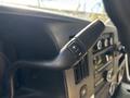 Close-up of a control lever from the interior of a 2017 Chevrolet Express featuring buttons for adjusting settings