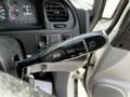 Close-up of the turn signal and headlight control lever on a 2003 Mitsubishi 7 Passenger Van
