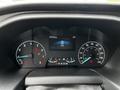 2022 Ford Transit dashboard display showing speedometer and fuel gauge with warning lights illuminated