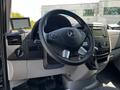Interior view of a 2017 Mercedes-Benz Sprinter showing the steering wheel dashboard controls and gear shift