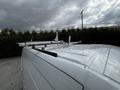 A 2020 Mercedes-Benz Sprinter van with a metallic roof rack installed on top