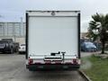 A white 2022 Ford E-450 box truck facing rear with a liftgate attached and no visible markings or logos