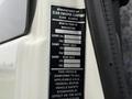 A vehicle specifications label for a 2009 UD Trucks UD 3300 detailing weight limits and manufacturing information