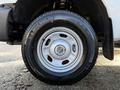 A close-up view of a silver wheel on a 2012 Ford F-350 featuring a Michelin LTX A/T tire