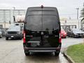 A black 2022 Mercedes-Benz Sprinter van viewed from the rear with a smooth surface and the model name "SPRINTER" displayed on the rear door
