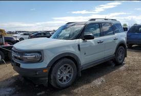 A 2023 Ford Bronco Sport parked on a gravel surface with a light blue exterior and rugged tires