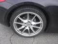 Close-up of a 2016 Porsche Boxster wheel showcasing a silver alloy rim and brake caliper