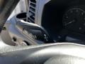 Close-up of a control stalk inside a 2023 Ford Transit showing indicators and headlight controls