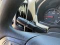 A close-up view of the steering wheel of a 2016 GMC Sierra 1500 showing the turn signal and wiper control stalk with various setting options