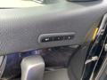 Close-up of a 2015 Kia Sorento driver side door with seat adjustment buttons labeled SET 1 and 2