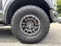 A close-up of a black alloy wheel with a rugged Goodyear tire mounted on a 2019 Ford F-150 showing the intricate design of the wheel and the tread pattern of the tire