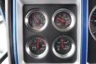 Dashboard gauges of a 2015 Kenworth T660 displaying DEF level oil pressure battery voltage and water temperature readings