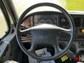 Steering wheel of a 2016 Freightliner M2 106 truck with various gauges and controls visible on the dashboard