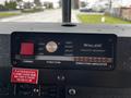 Dashboard control panel featuring a Whelen Traffic Advisor with buttons for power function and direction indicators