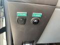 Two green switches labeled "STROBE" and "FLOOD" mounted on a textured panel in a vehicle interior