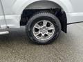 A 2016 Ford F-150 truck tire and alloy wheel with a Goodyear tire tread mounted on it