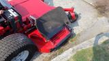 2014 Ferris Mower ISX 800 with a red body and large rear wheels featuring a black discharge chute in the lowered position