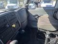 Interior view of a 2007 International 7300 truck featuring a driver's seat dashboard control panel and gear shift in the foreground
