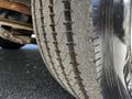 Close-up of a worn tire on a 2000 Ford Motorhome showing visible tread wear and a shiny sidewall