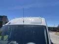 The top of a white 2016 RAM Promaster van featuring multiple clearance lights and an antenna
