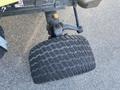 Close-up of the front tire of a 2010 Kubota F3680 showcasing its tread pattern and wheel assembly