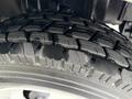 Close-up view of a rugged tire from a 2012 International TerraStar showcasing its tread pattern and rubber texture