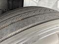 A close-up view of a tire from a 2017 Hino 338 showing tread patterns and wear marks on the rubber surface