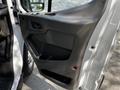 The interior door panel of a 2021 Ford Transit featuring a handle a storage compartment and a window control switch
