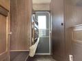 Interior view of a 2018 Westland Travelaire with wooden cabinetry and a doorway leading outside