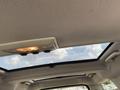 Interior view of a 2006 Land Rover LR3 showing a sunroof and interior lighting details