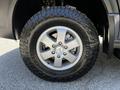 Close-up of a silver alloy wheel with a rugged tire on a 2017 Mercedes-Benz Sprinter