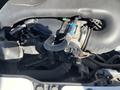 A 2016 Ford Transit engine featuring various mechanical components including hoses and an intake manifold