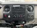 The interior dashboard of a 2008 Ford F-450 SD showing the radio controls air conditioning knobs and various switches