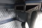 Interior of a 2015 Kenworth T660 featuring a quilted leather sleeping area and dark leather seat