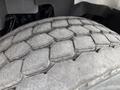 Close-up of a worn tire tread on a 2016 International 7600 showcasing distinct hexagonal patterns and signs of regular use