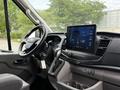 Interior view of a 2022 Ford Transit showcasing the steering wheel and a large central touchscreen display
