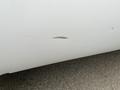 A 2010 Ford F-250 SD with a noticeable scratch on the side panel