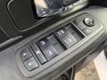 Close-up of the power window control panel for a 2021 RAM 1500 featuring buttons for locking windows and adjusting side mirrors