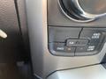 A control panel from a 2015 RAM 1500 featuring buttons for 2WD, 4WD lock, and 4WD low drive modes with an indicator light illuminated next to the 2WD button