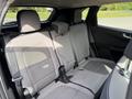 Interior of a 2020 Ford Escape featuring grey fabric seats with a diamond pattern and a center headrest in the back seat area
