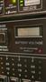 Control panel of a 2007 Winnebago Adventure displaying battery voltage and solar charging indicators