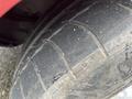 Close-up of the tire of a 1970 Chevrolet Corvette showing tread patterns with some wear and dirt on the surface