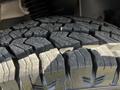 Close-up of a tire tread from a 2022 Mercedes-Benz Sprinter showing robust grooves and patterns designed for traction and performance
