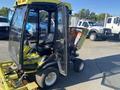 A 2010 Kubota F3680 with a yellow cab features a black seat and controls, designed for landscaping or grounds maintenance