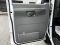 2008 Ford Econoline van door with a gray interior panel featuring a handle and storage pocket