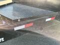2024 Southland 18 Foot Dump Trailer with a textured metal bed and reinforced sides for hauling materials
