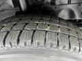 Close-up of a worn tire tread on a 2017 Ford Transit 350 showcasing deep grooves and wear patterns