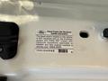 A label inside a 2009 Ford F-550 providing diesel engine idle shutdown system information including regulatory compliance details