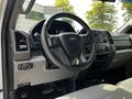Interior view of a 2017 Ford F-250 Super Duty featuring a steering wheel with controls and a dashboard with various buttons and displays